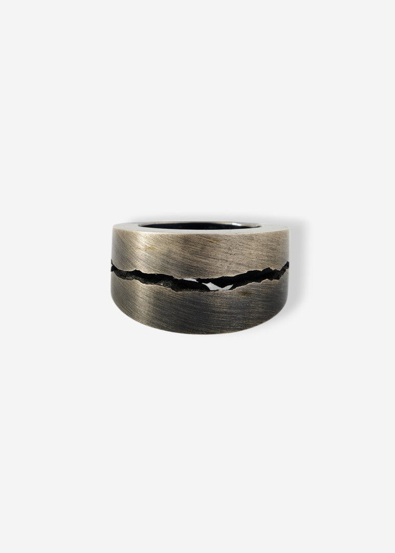 Silver ring with a crack