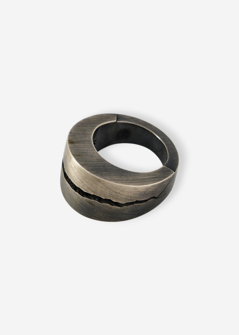 Silver ring with a crack