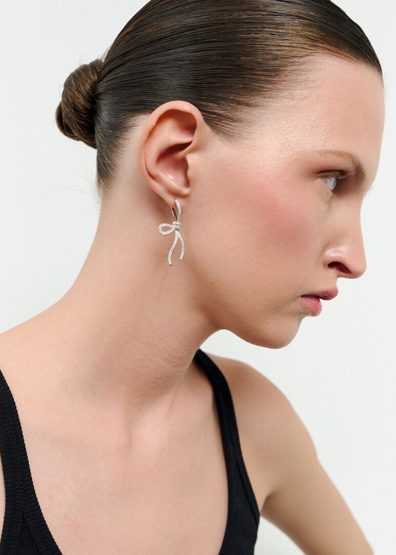 Silver bow earrings with crystals