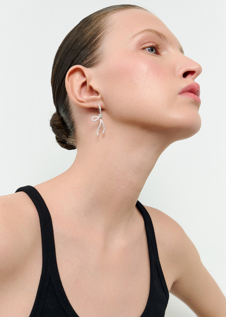 Silver bow earrings with crystals
