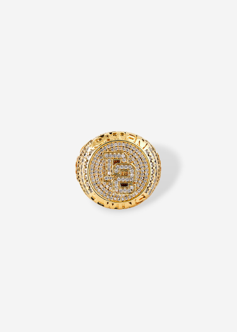 Round golden seal with engraved logo and crystals