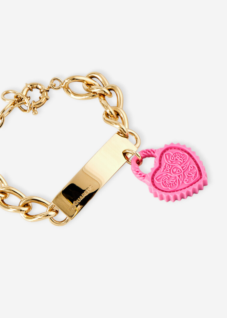 Golden chain bracelet with a pink heart