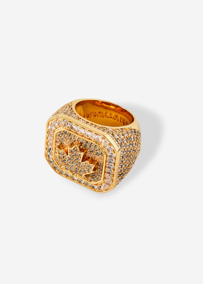 Square golden seal with engraved logo and crystals