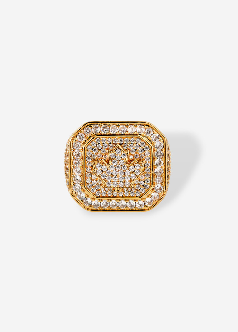 Square golden seal with engraved logo and crystals