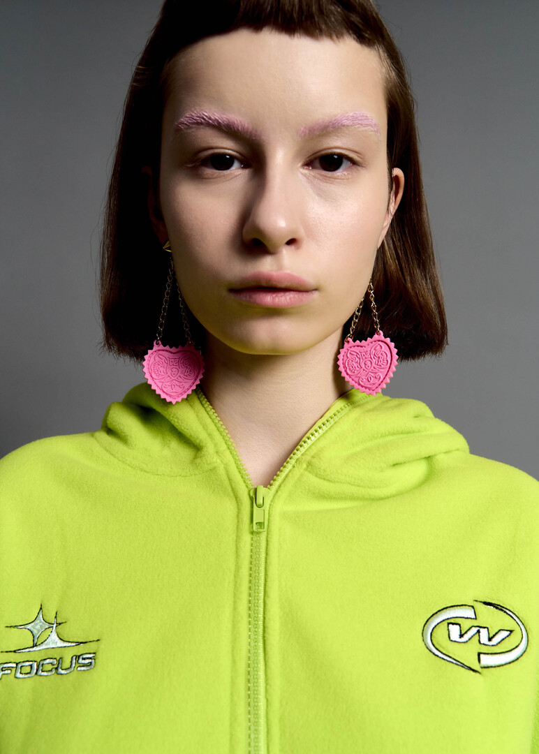 earrings with a pendant in the shape of a pink heart