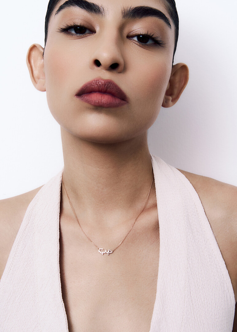 rose gold love necklace with baguette diamonds