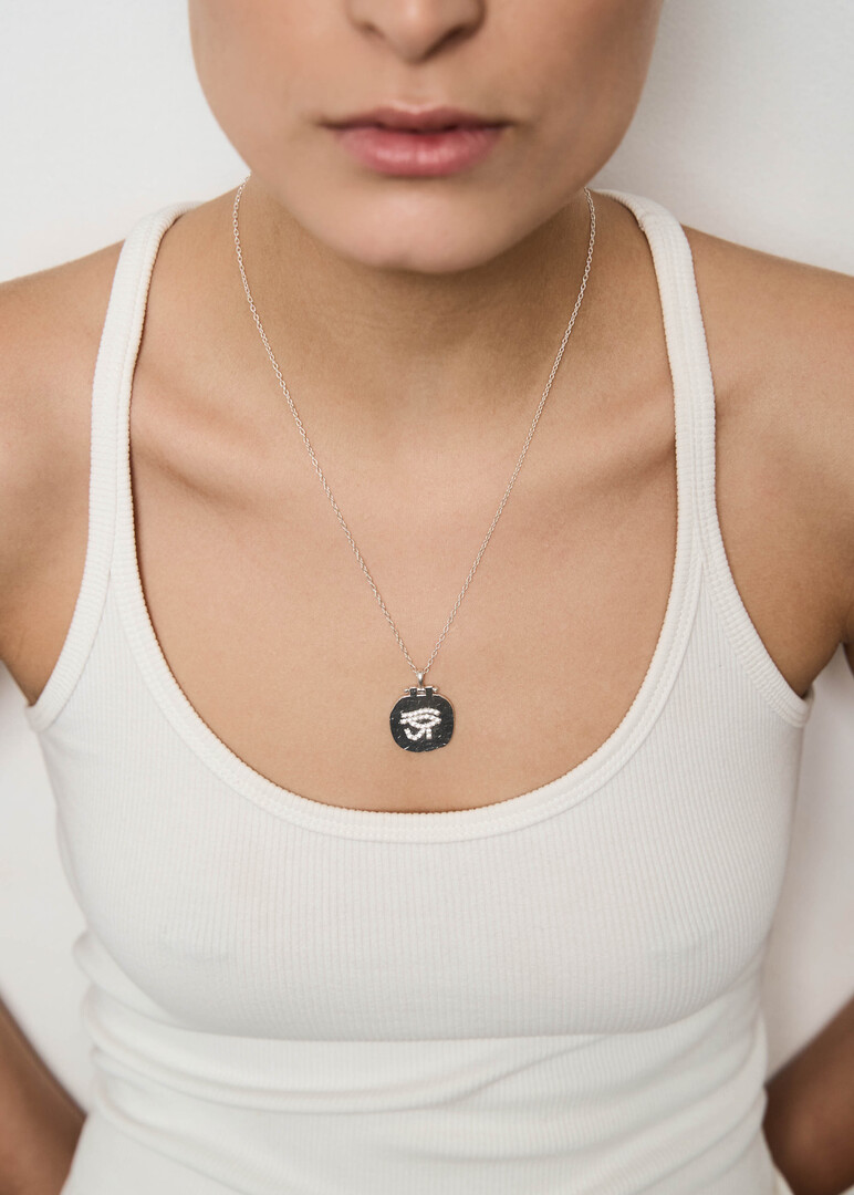 EYE OF HORUS pendant with white Topaz