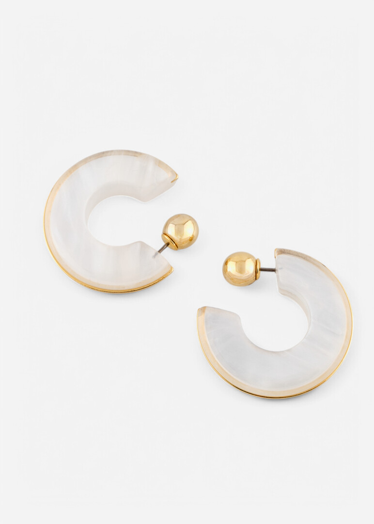 White earrings with a golden rim