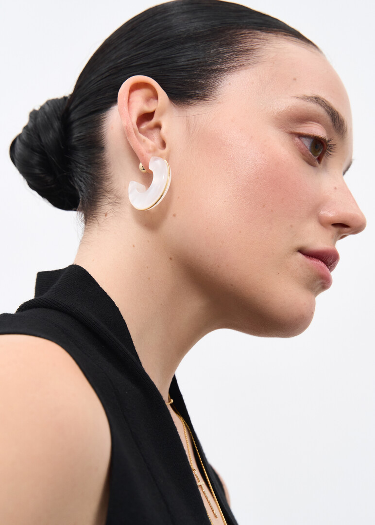 White earrings with a golden rim