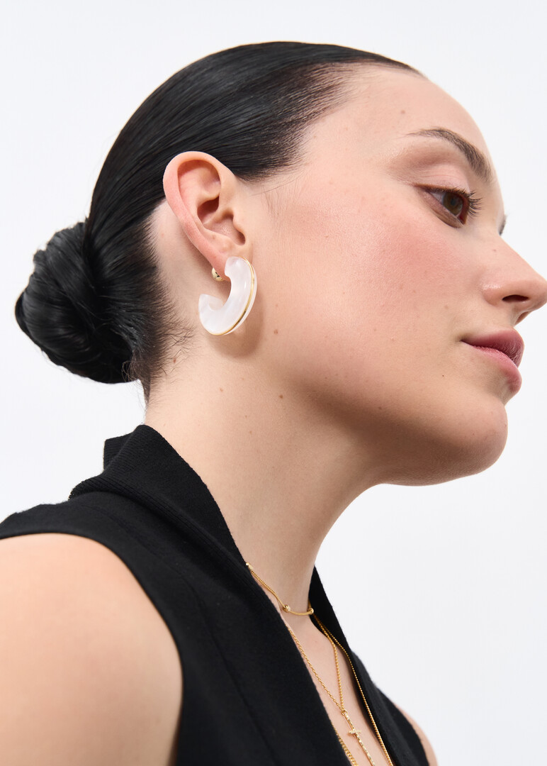 White earrings with a golden rim