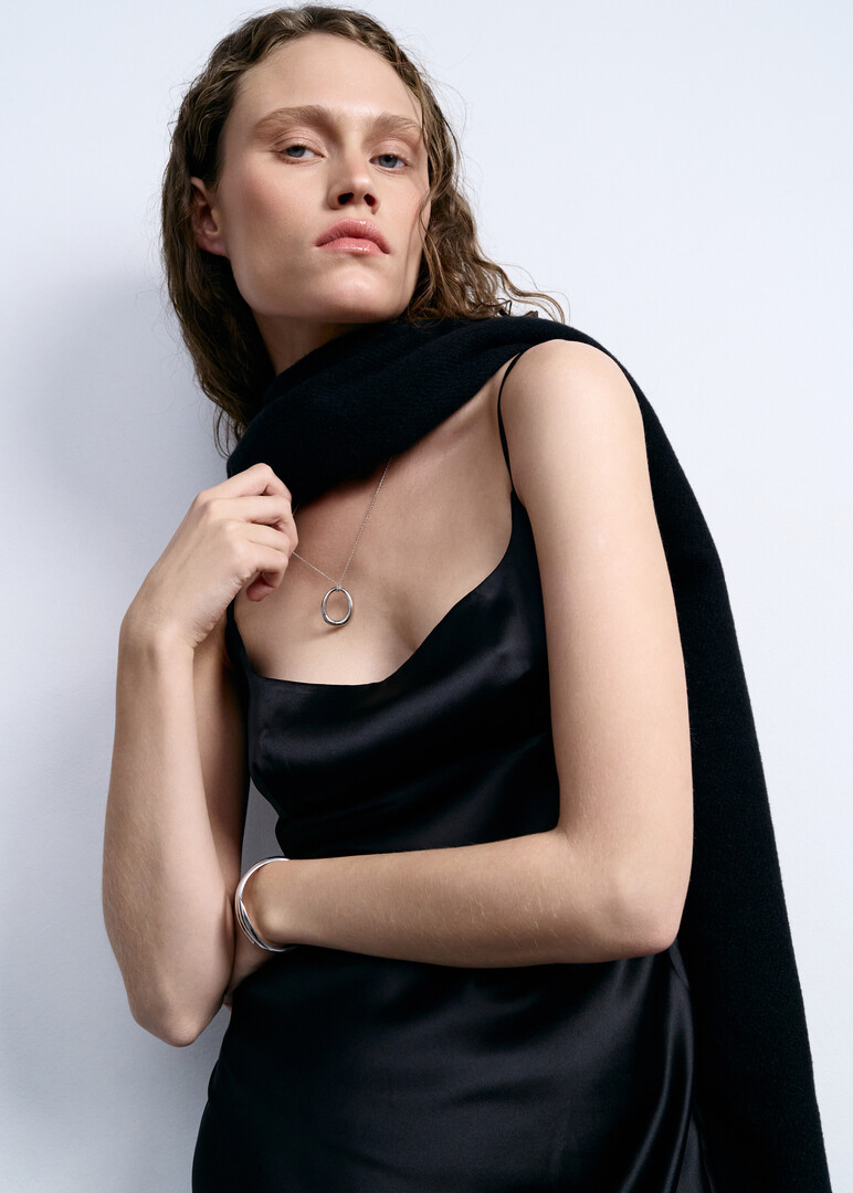 silver necklace with a ring pendant