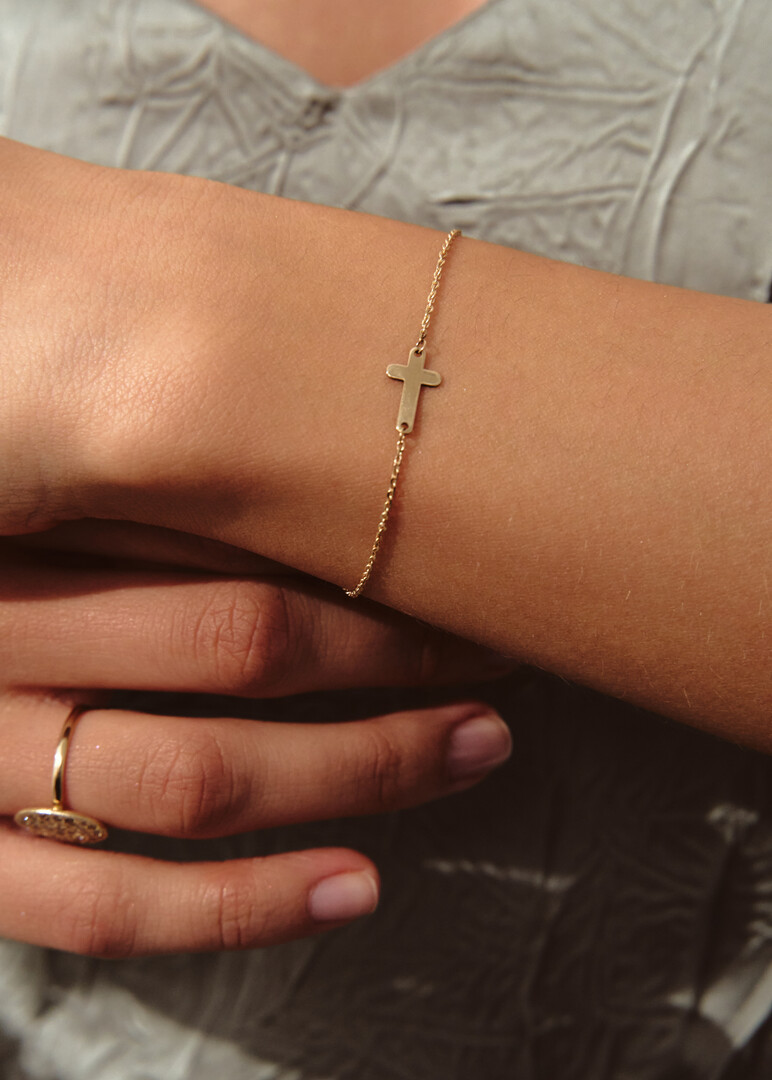 gold bracelet with a cross