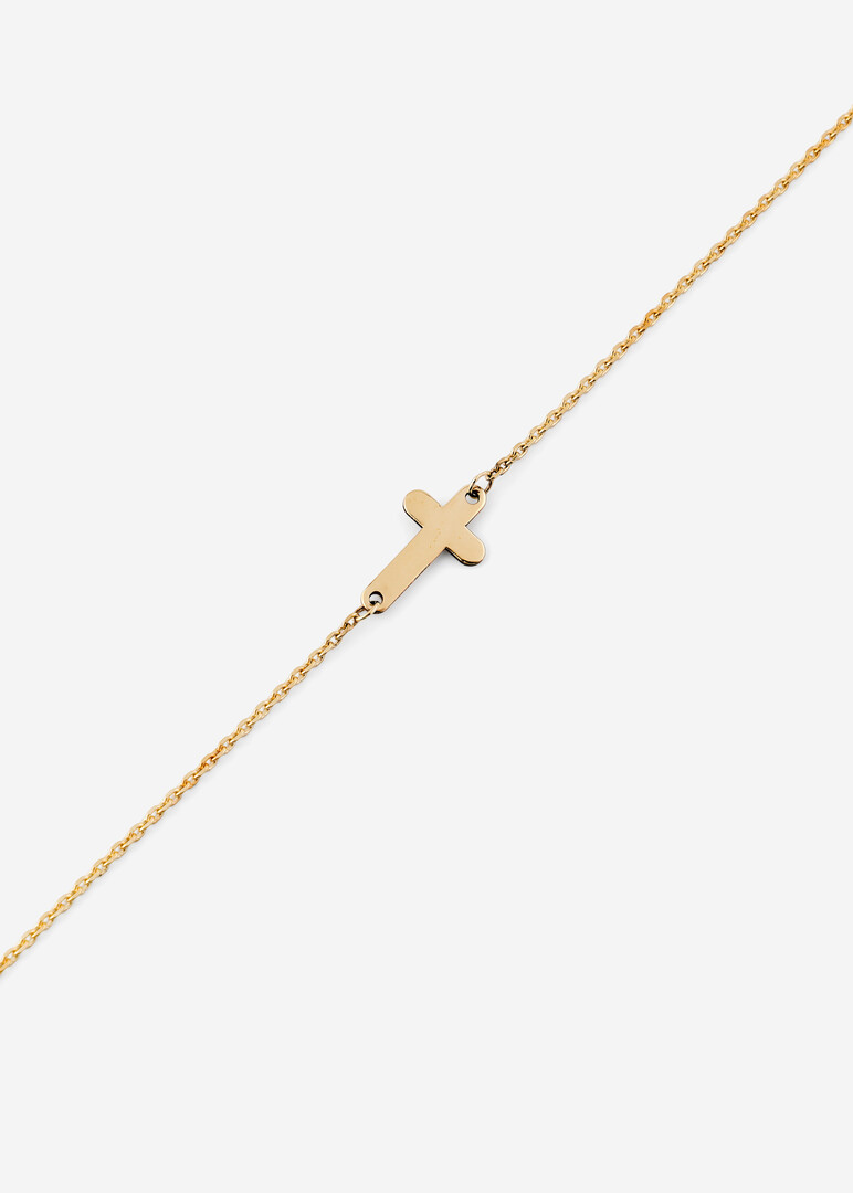 gold bracelet with a cross