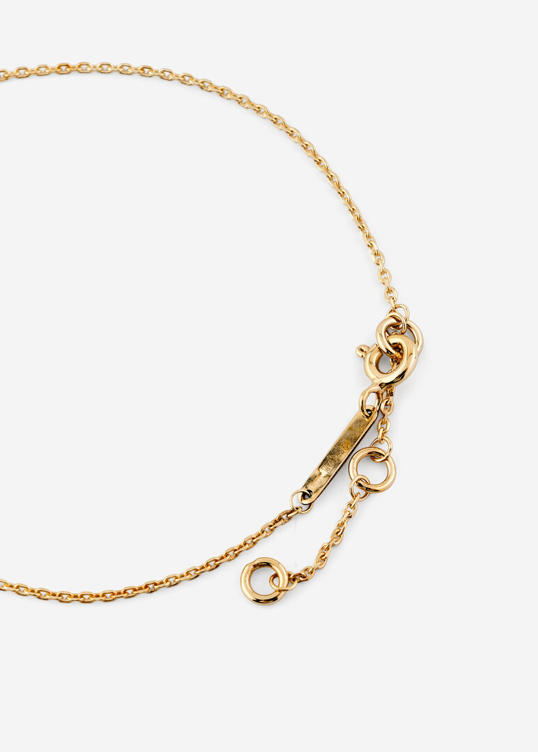 gold bracelet with a cross