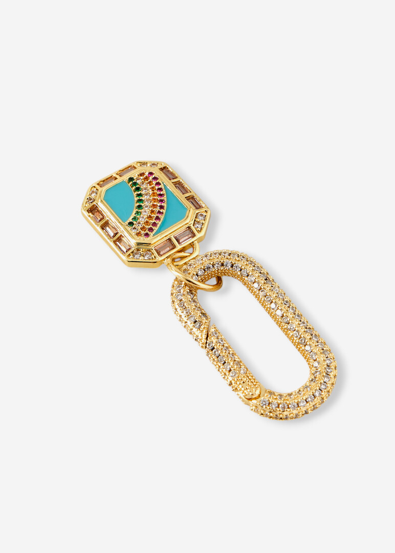 golden pendant on the rainbow bar pendant bag