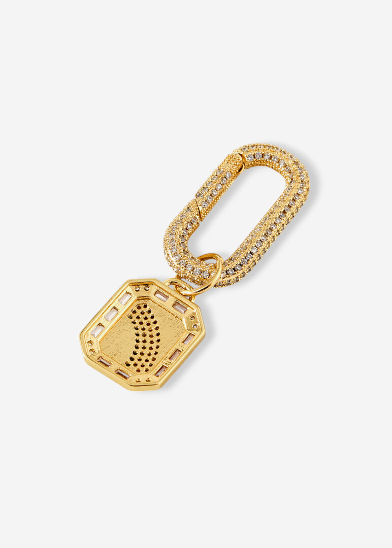 golden pendant on the rainbow bar pendant bag
