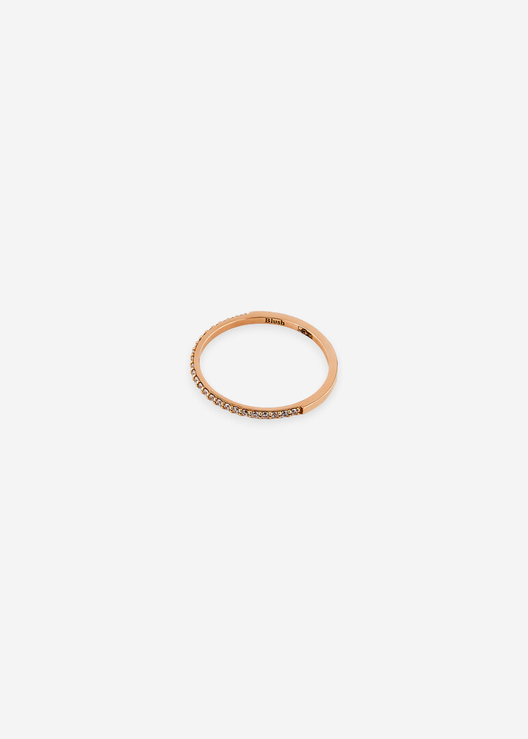 pink gold ring with a row of cubic zirconias