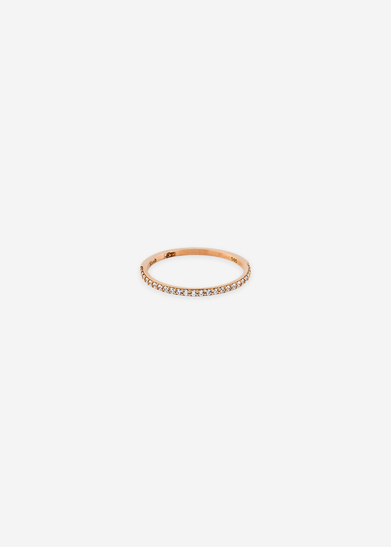 pink gold ring with a row of cubic zirconias