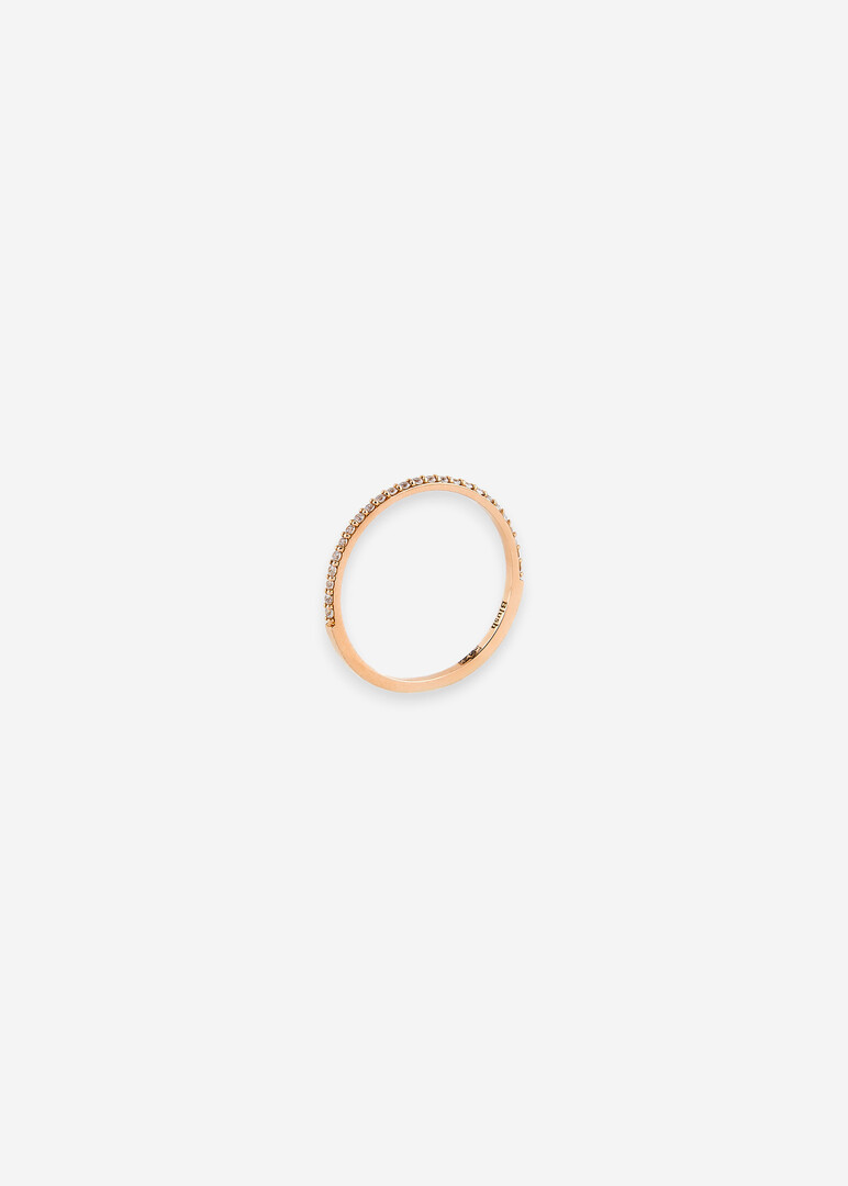 pink gold ring with a row of cubic zirconias