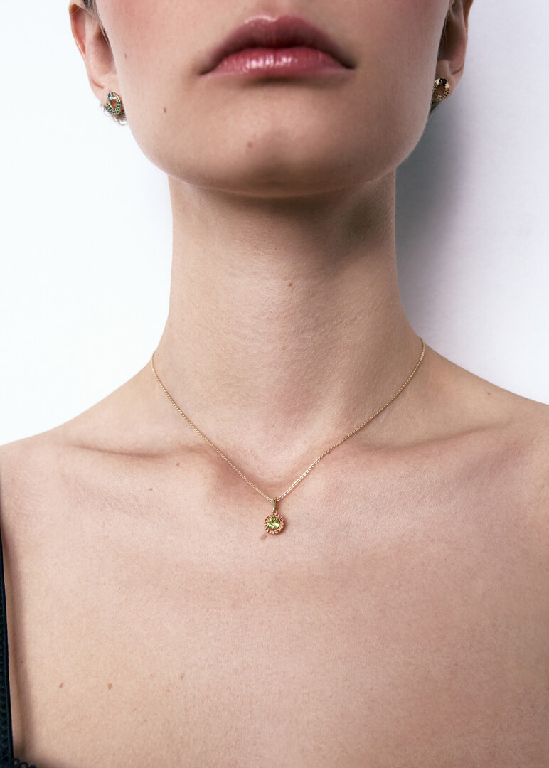 gold chrysolite and cubic zirconia pendant