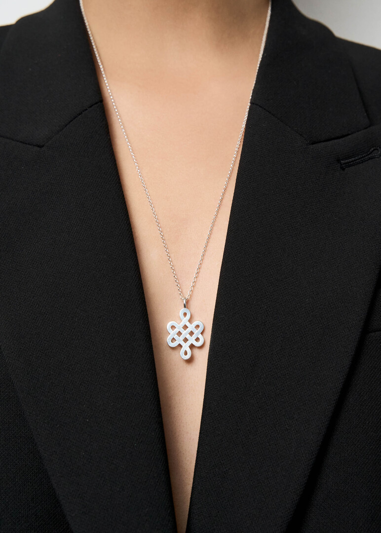 Silver pendant on an Endless Knot chain