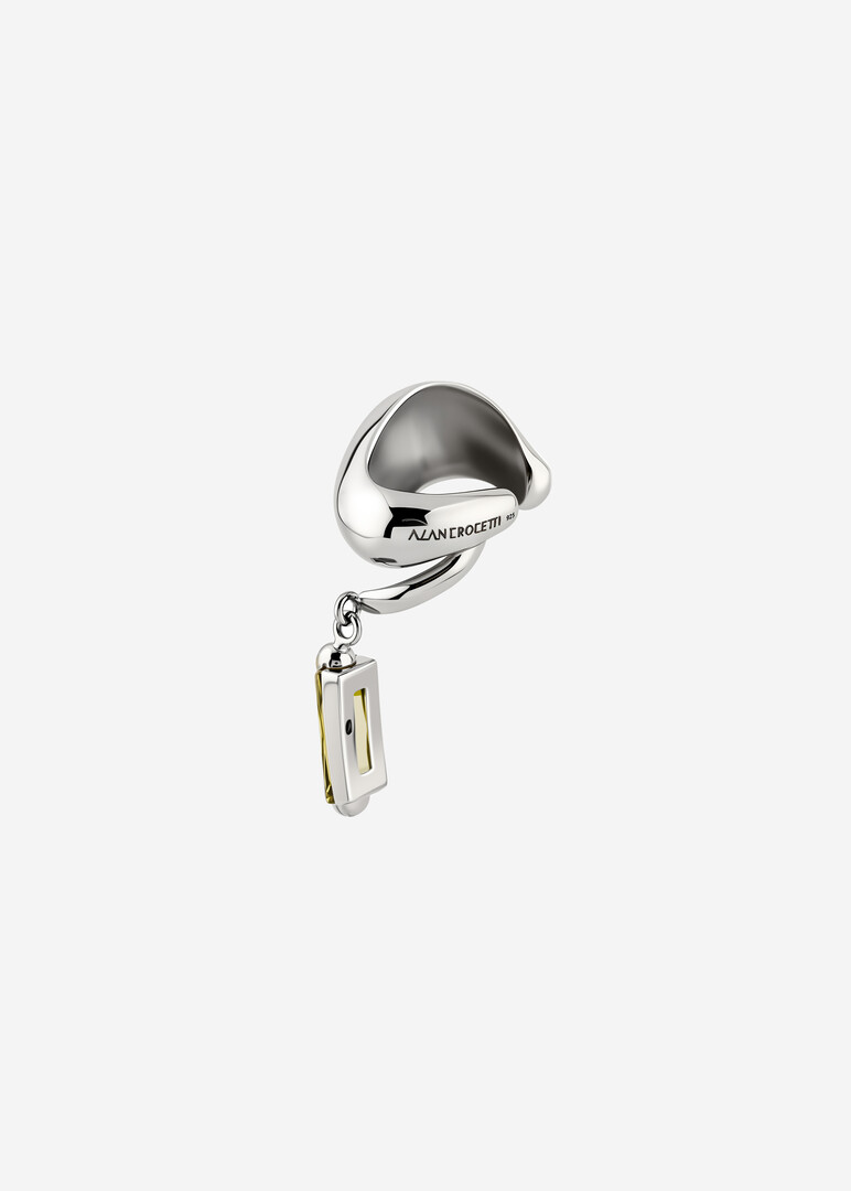 silver cuff with green cubic zirconia for the left ear