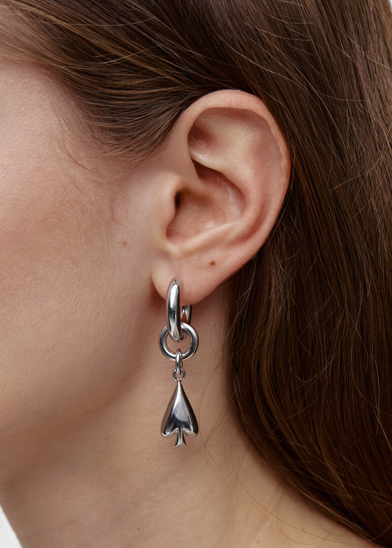 Asymmetric WINKING SPADE transformer earrings made of steel and bronze with rhodium coating