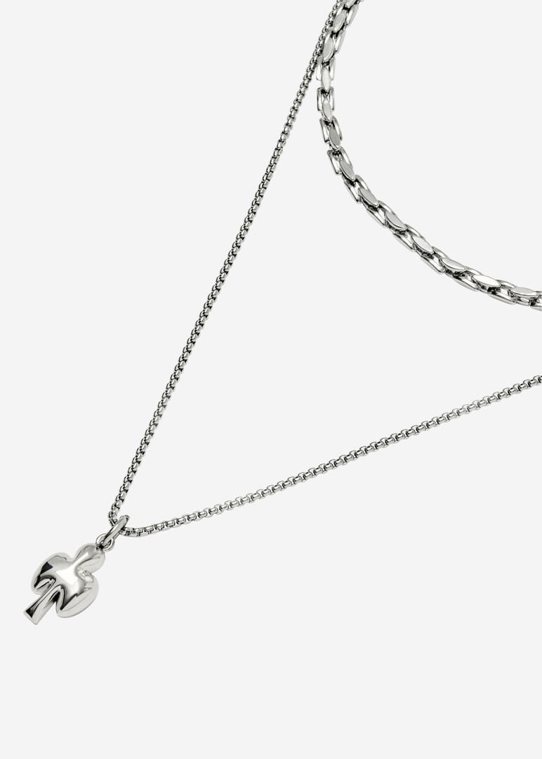 A necklace of two types of chains with a pendant in the form of a card suit CLUB clubs made of steel and bronze with rhodium coating