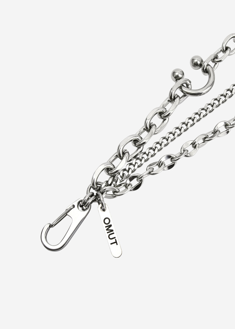 Double bracelet made of multi-caliber chains and piercing elements of DARE made of steel