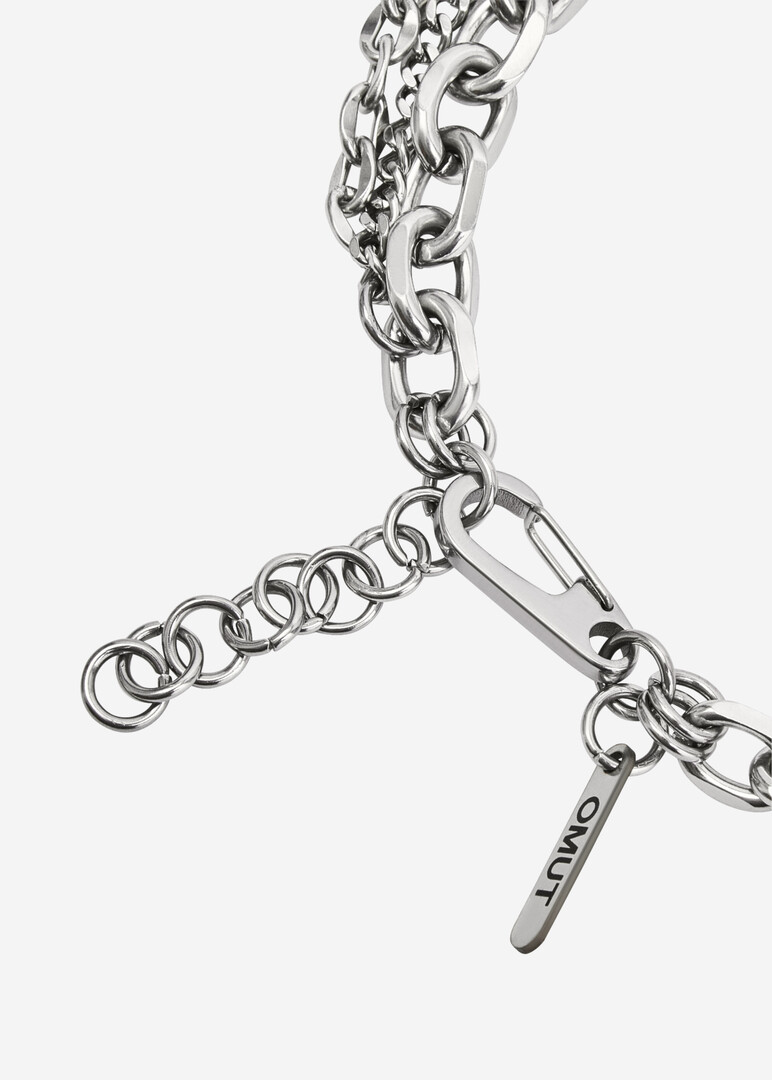 Double bracelet made of multi-caliber chains and piercing elements of DARE made of steel