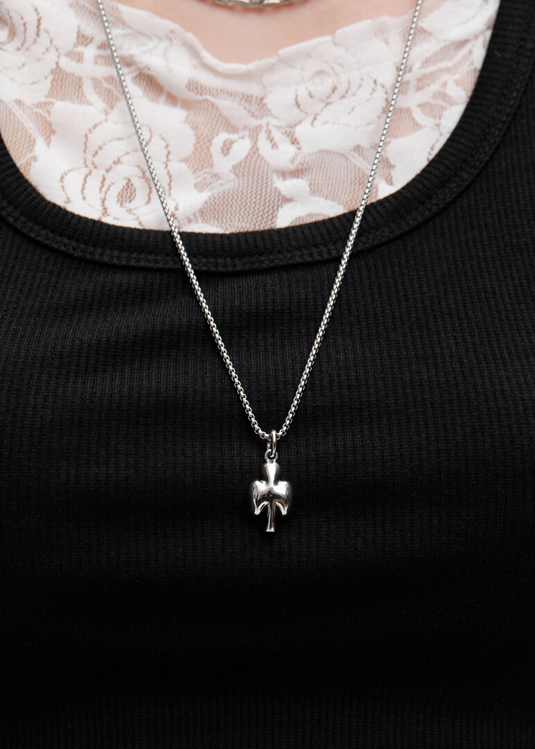 A necklace of two types of chains with a pendant in the form of a card suit CLUB clubs made of steel and bronze with rhodium coating