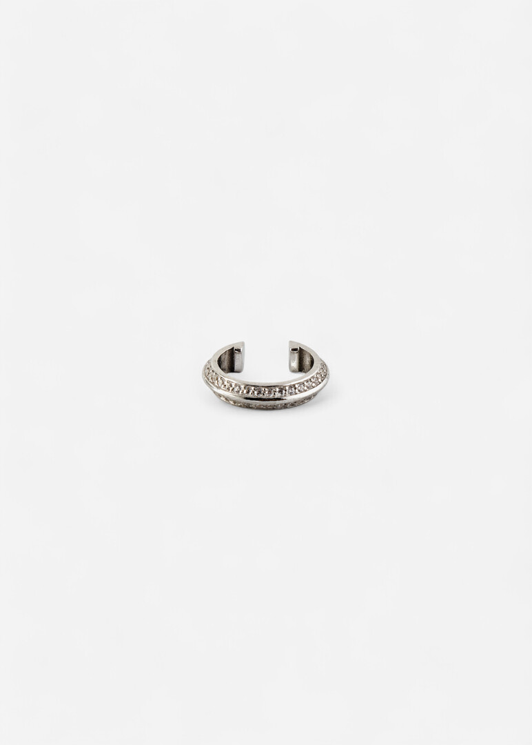 The cuff made of silver with cubic zirconia "Saturn" is narrow in the middle