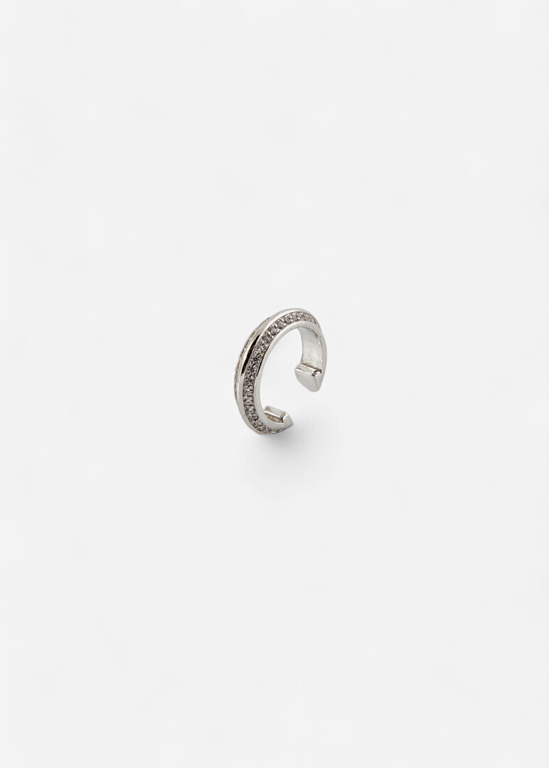 The cuff made of silver with cubic zirconia "Saturn" is narrow in the middle