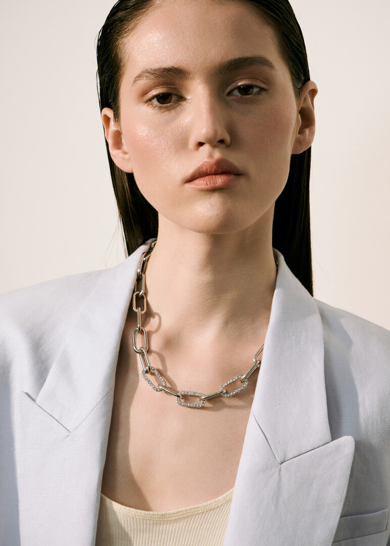 silver-tone chain with crystal