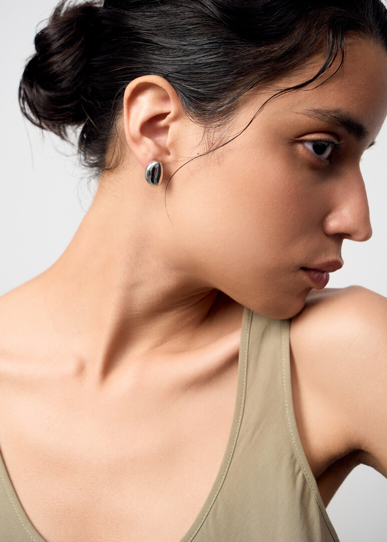 Small oval clip-on earrings.