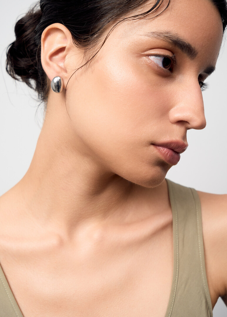 Small oval clip-on earrings.