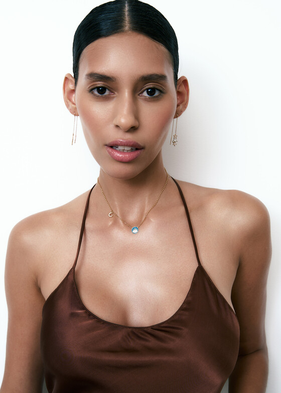 gold necklace with enamel and diamond pendant
