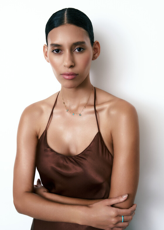 gold chain necklace with diamond, tourmaline, and white enamel pendants