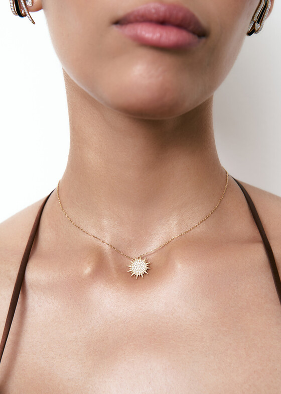 gold necklace with diamond sun pendant