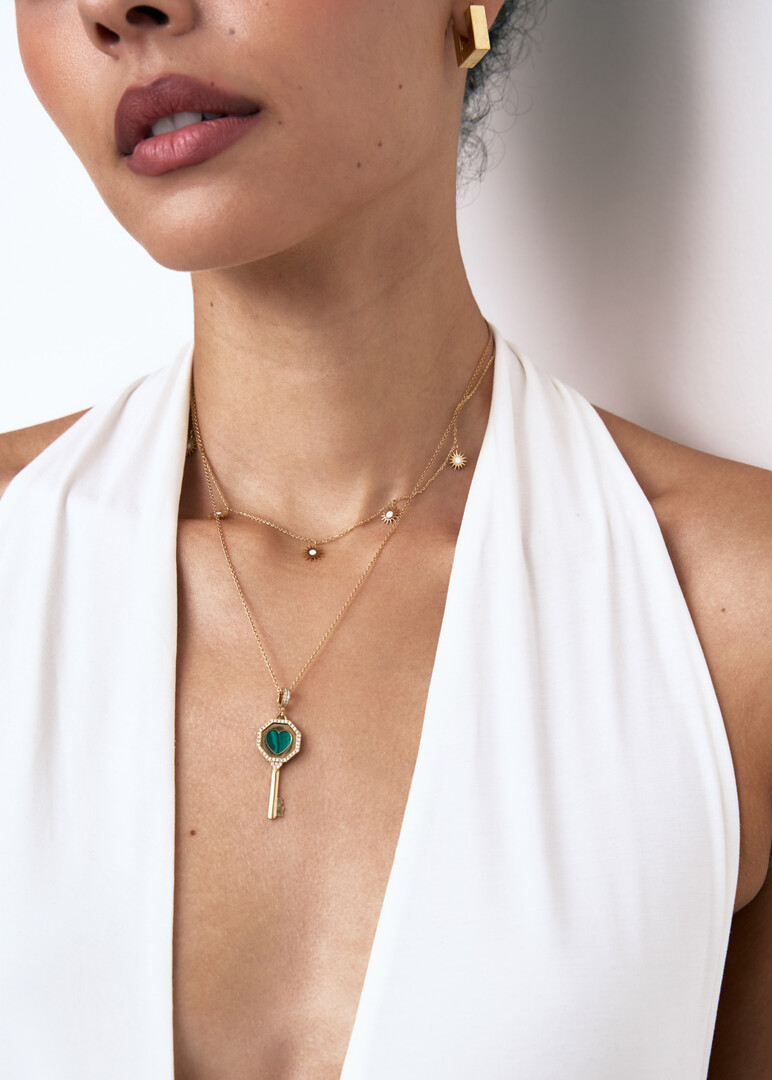 Gold chain with multiple sun pendants