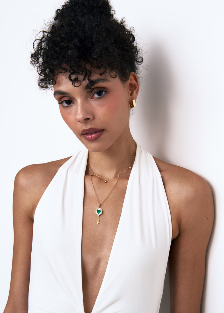 Gold chain with multiple sun pendants