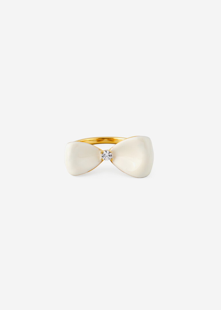 gold-tone ring with white bow