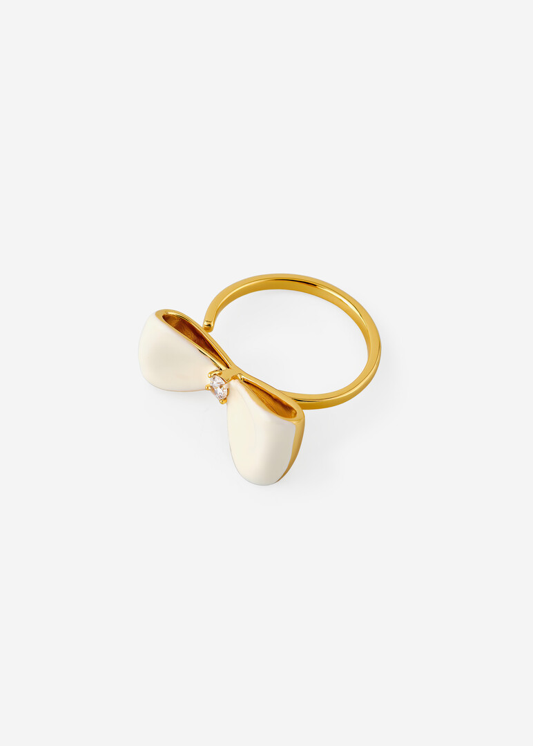 gold-tone ring with white bow