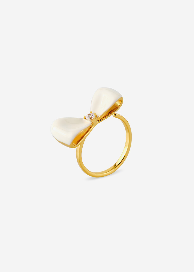 gold-tone ring with white bow