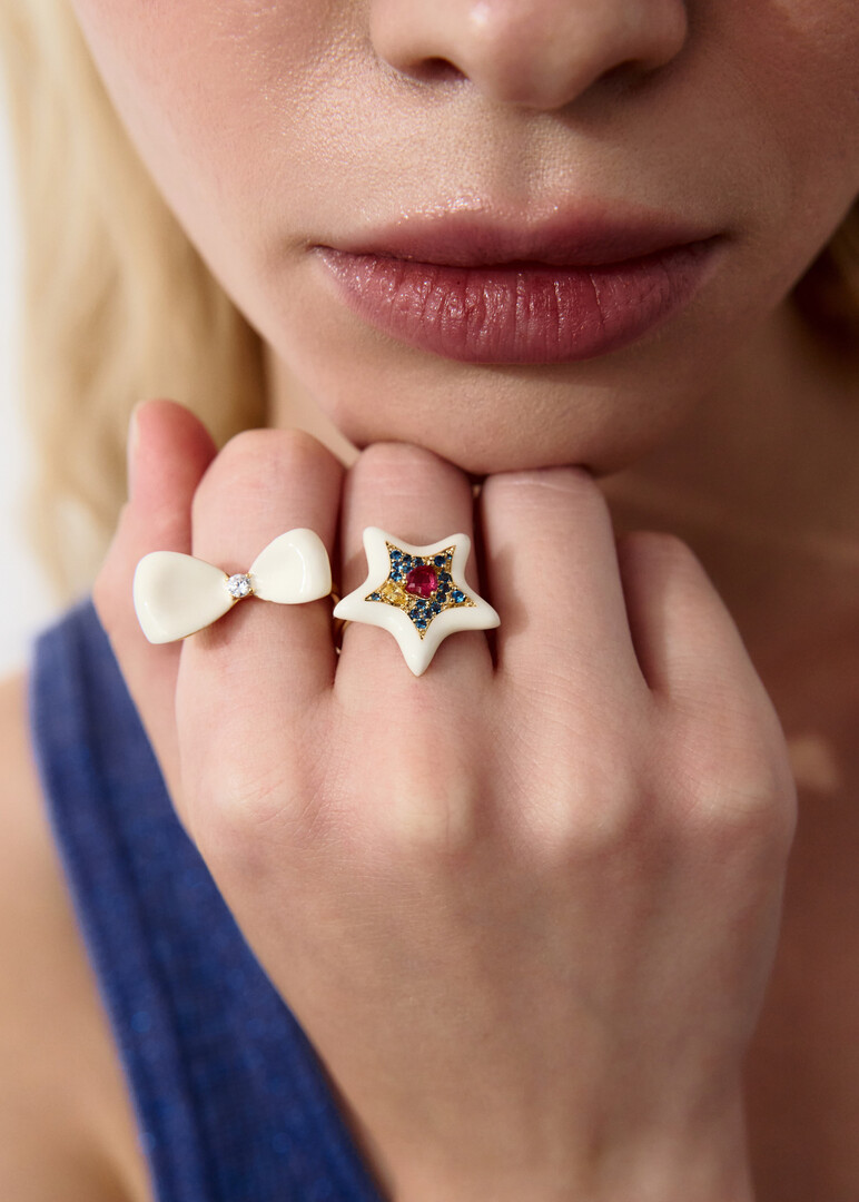 gold-tone ring with white bow