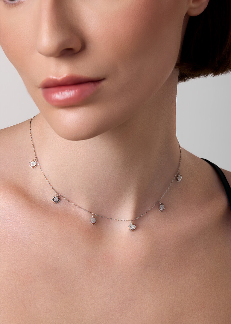 White Gold chain with multiple sun pendants
