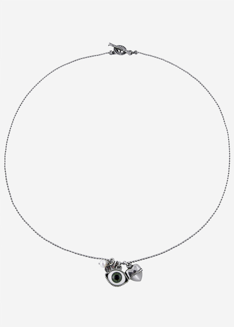 silver chain necklace with a green eye pendant