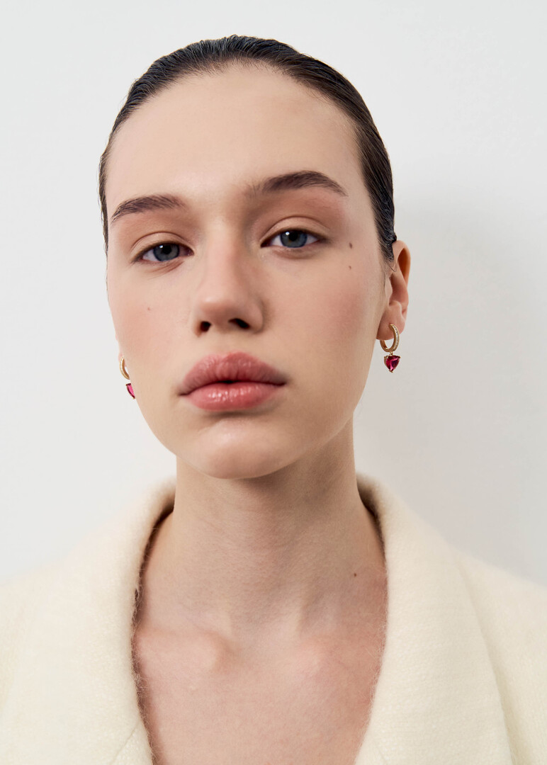 Small gold hoop earrings with red hearts