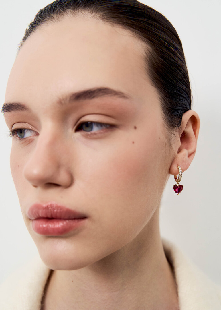 Small gold hoop earrings with red hearts