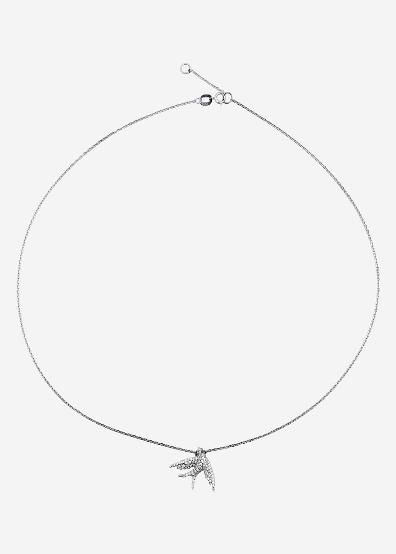 gold necklace with bird pendant and diamonds